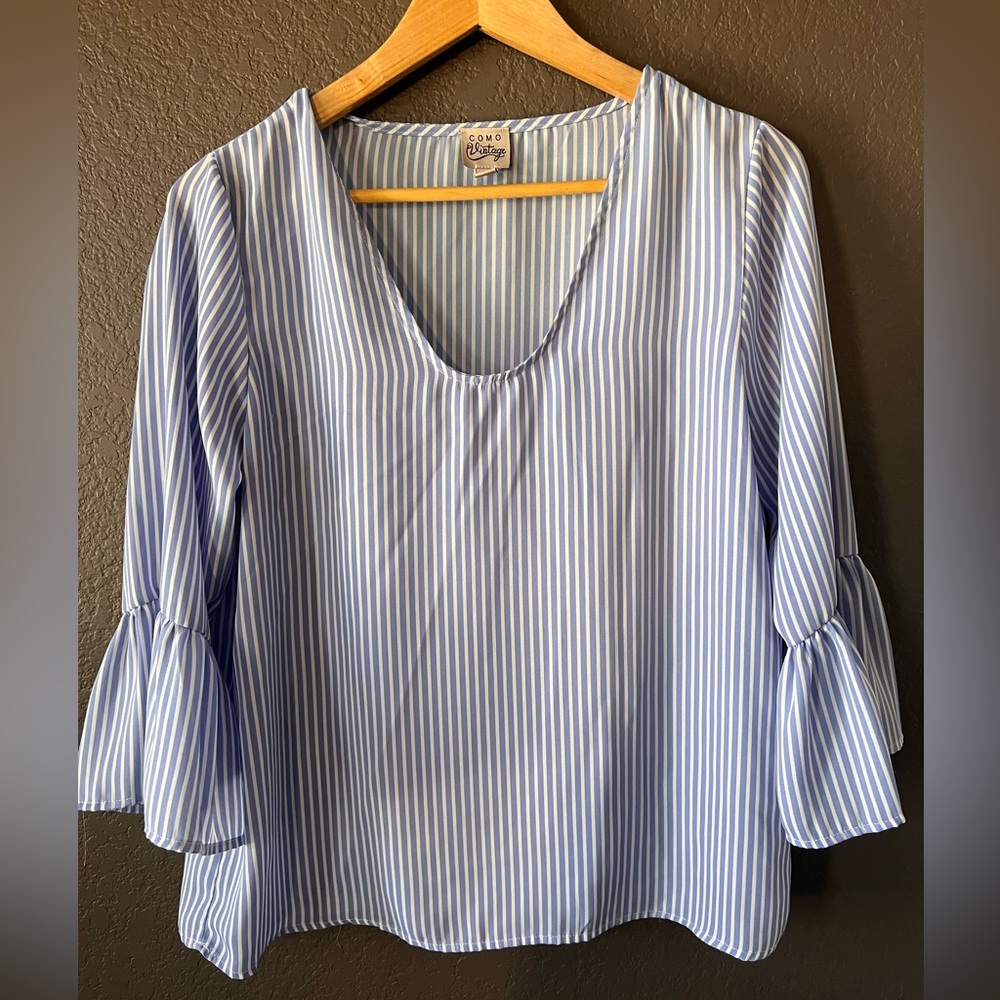 Woman’s blue and white flare sleeve small blouse